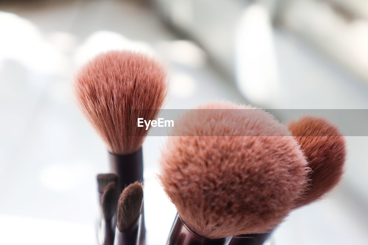 close-up of make-up brushes on table