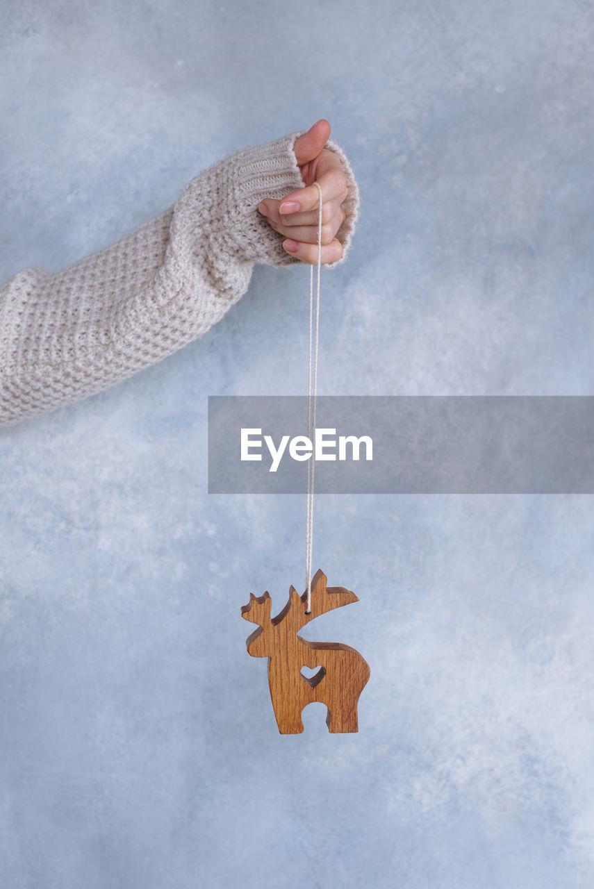 one person, hand, holding, cloud, adult, nature, art, rope, winter, studio shot, hanging