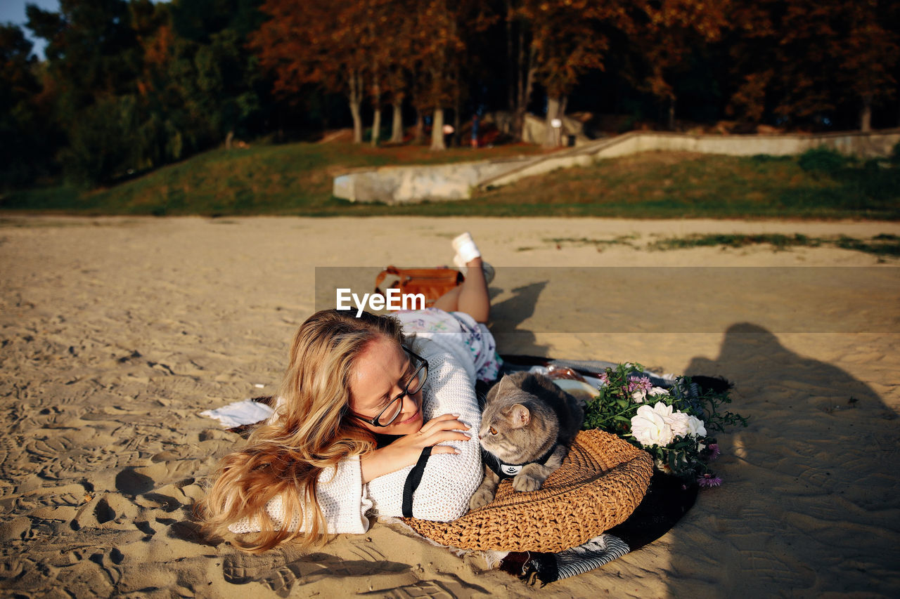 Young couple sitting on wicker basket