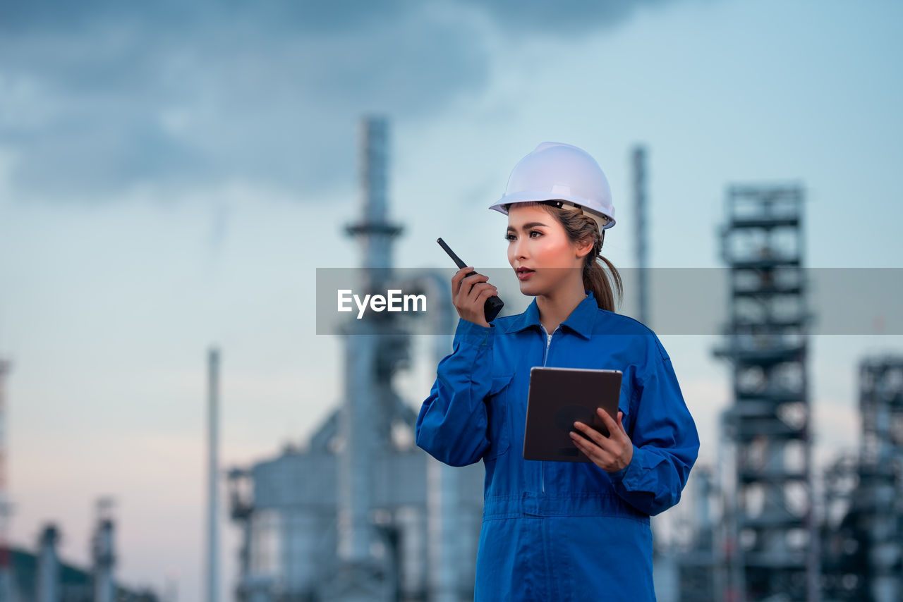 Engineer inspecting in industrial oil refinery. industry 4.0 concept.