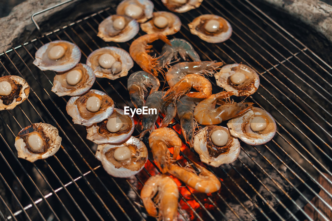 high angle view of meat on barbecue grill