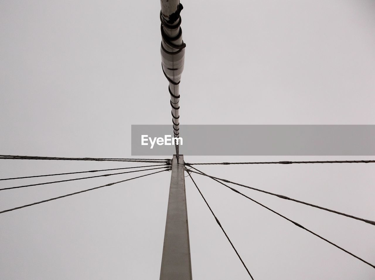 LOW ANGLE VIEW OF POLE AGAINST CLEAR SKY