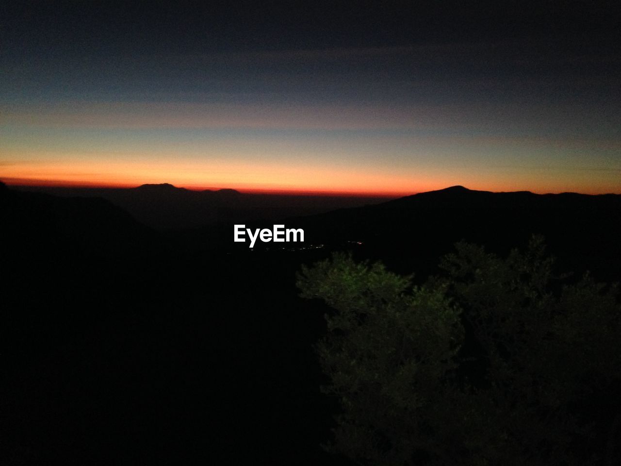 SILHOUETTE OF MOUNTAINS AT SUNSET