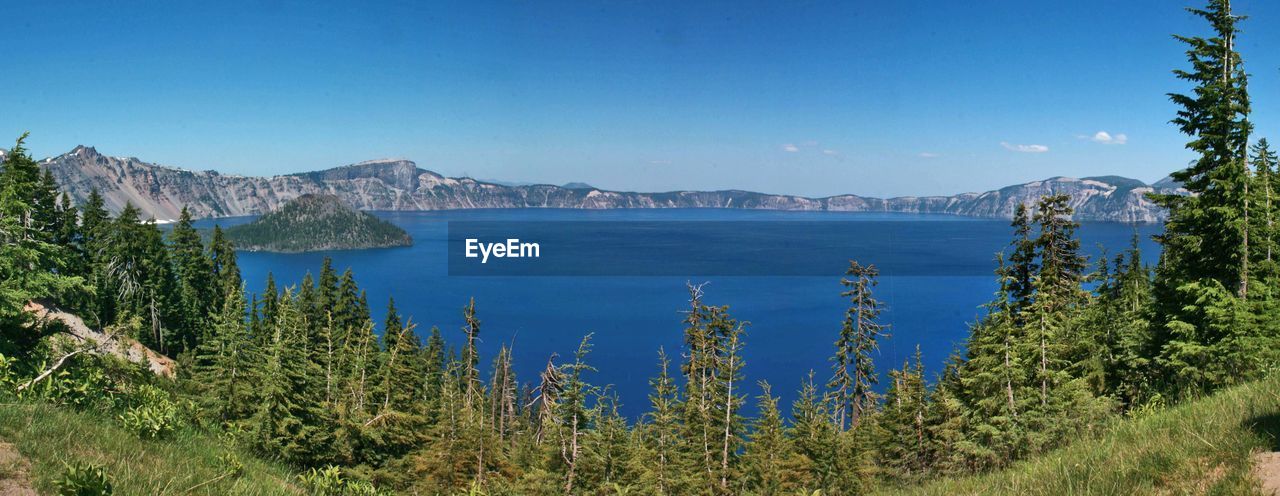 Scenic view of sea against clear blue sky