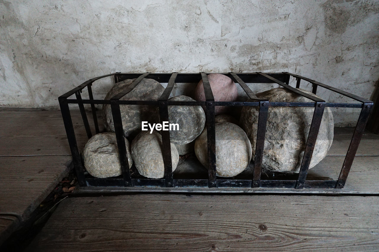 High angle view of cannon balls on floor in castle