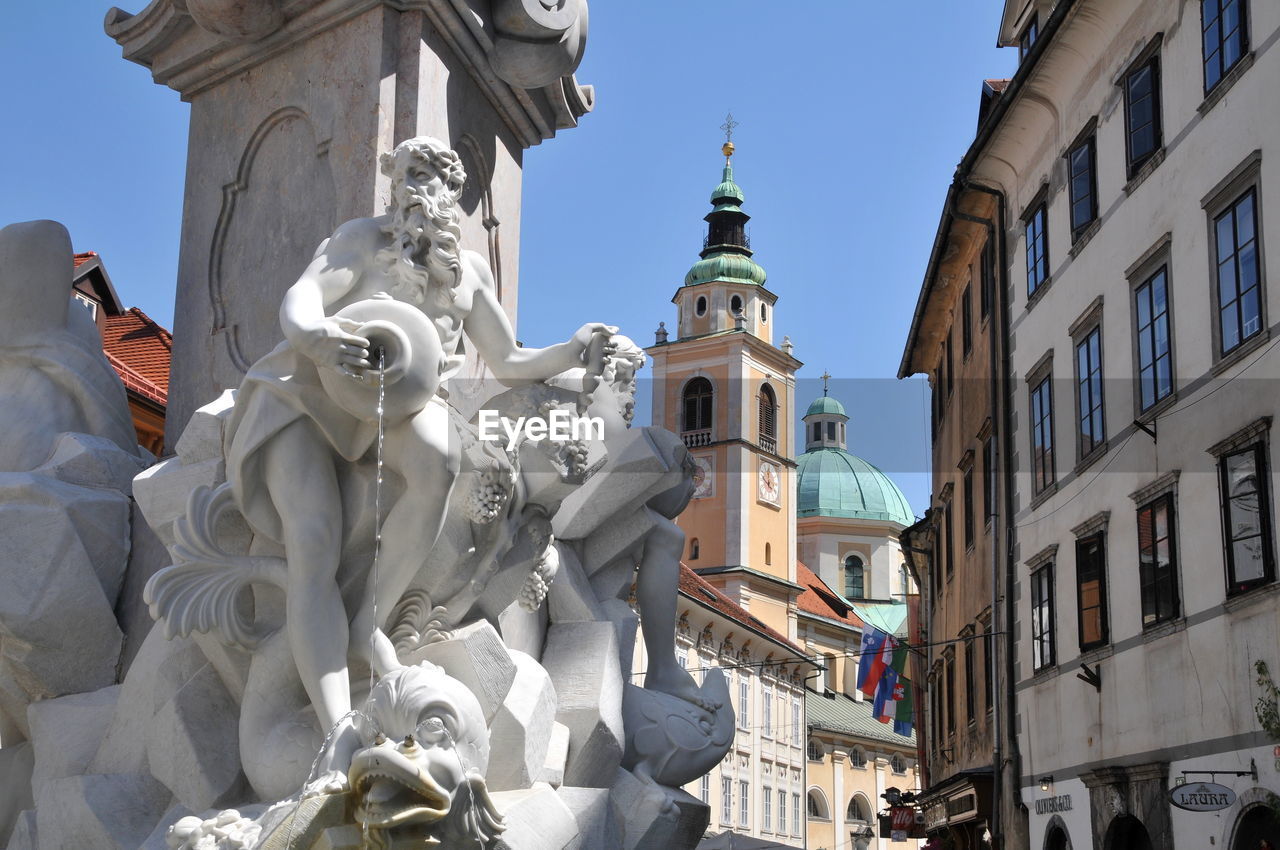 LOW ANGLE VIEW OF STATUE OF BUILDINGS