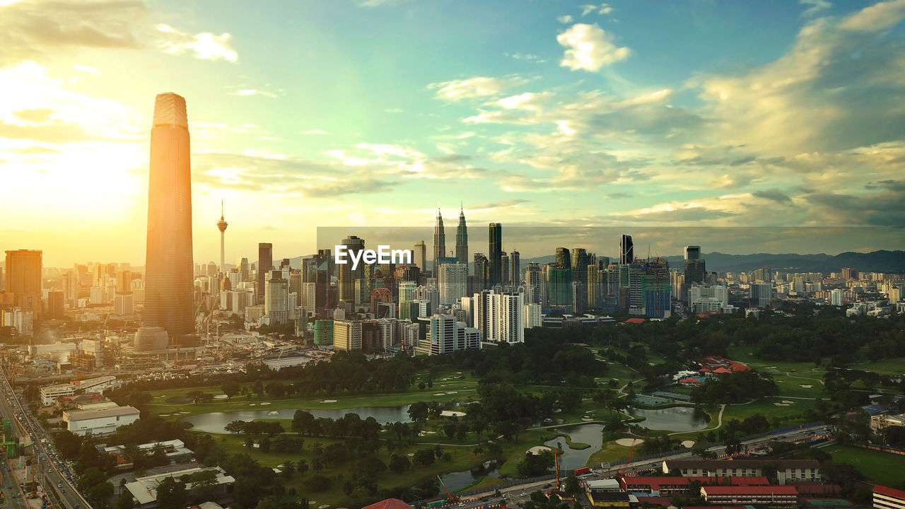 CITYSCAPE AGAINST SKY DURING SUNSET