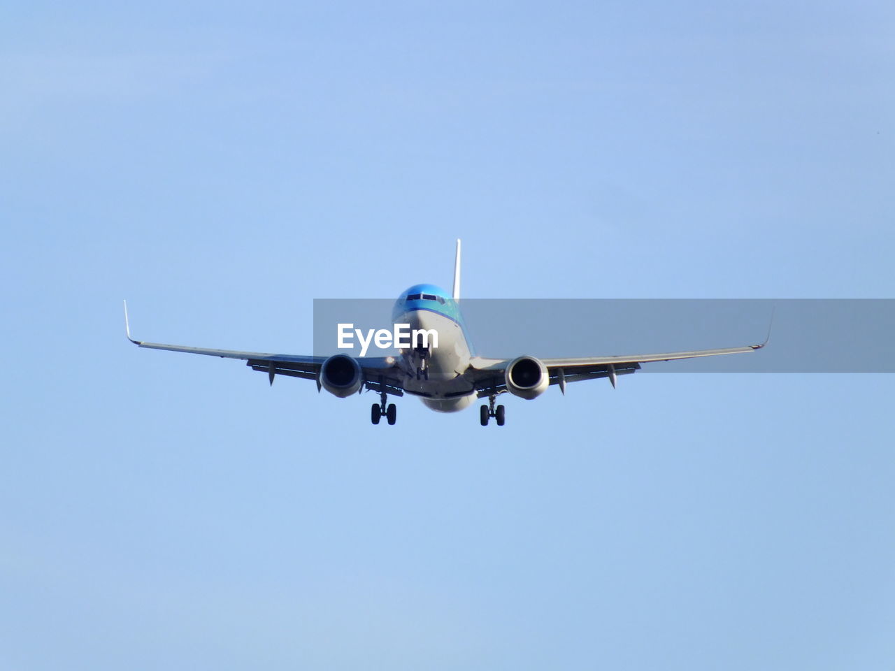 Low angle view of airplane flying in clear sky