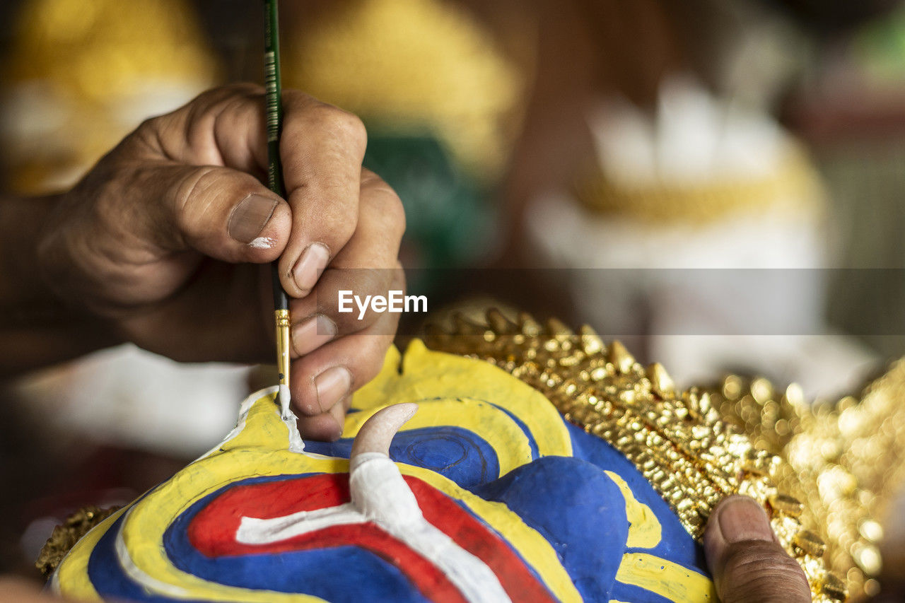 hand, one person, adult, yellow, holding, craft, tradition, focus on foreground, close-up, food, occupation