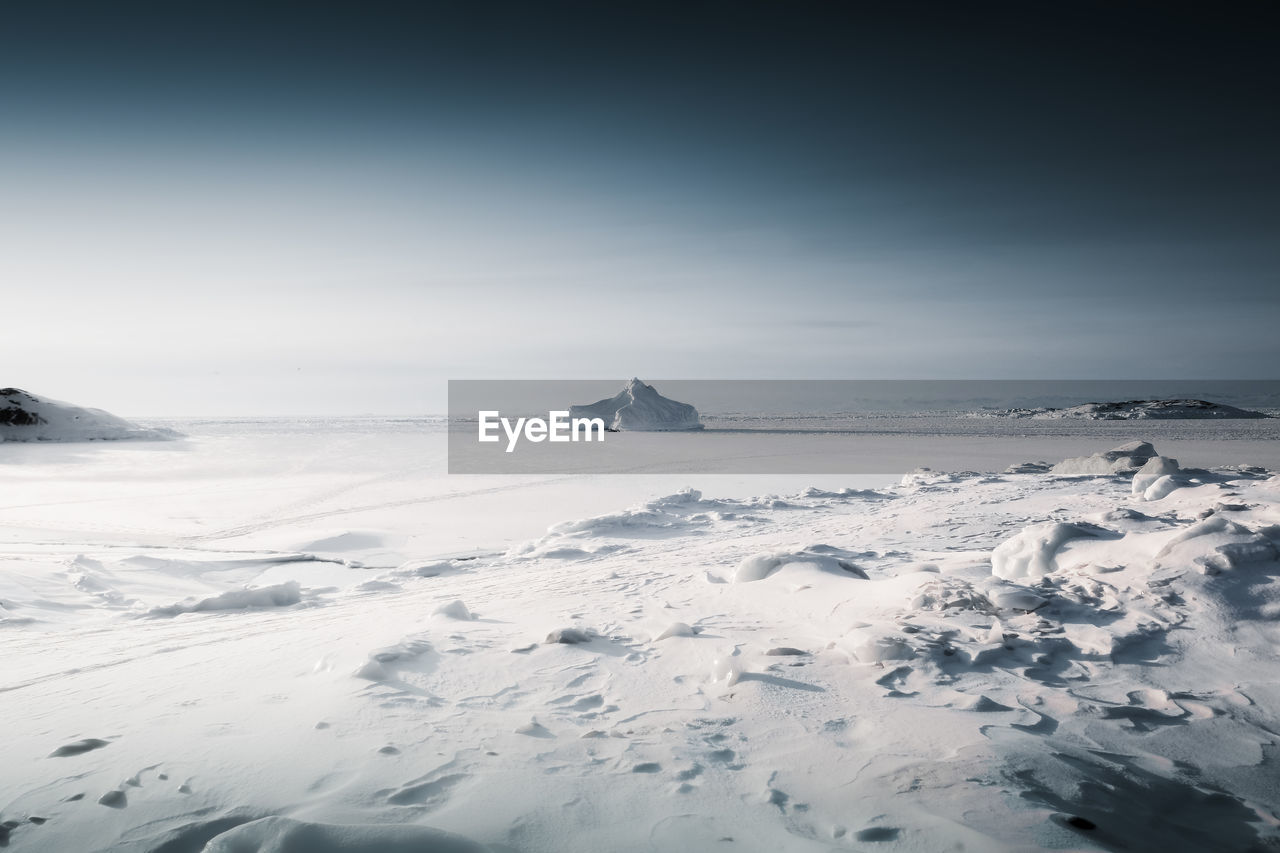 SCENIC VIEW OF SNOW COVERED LAND