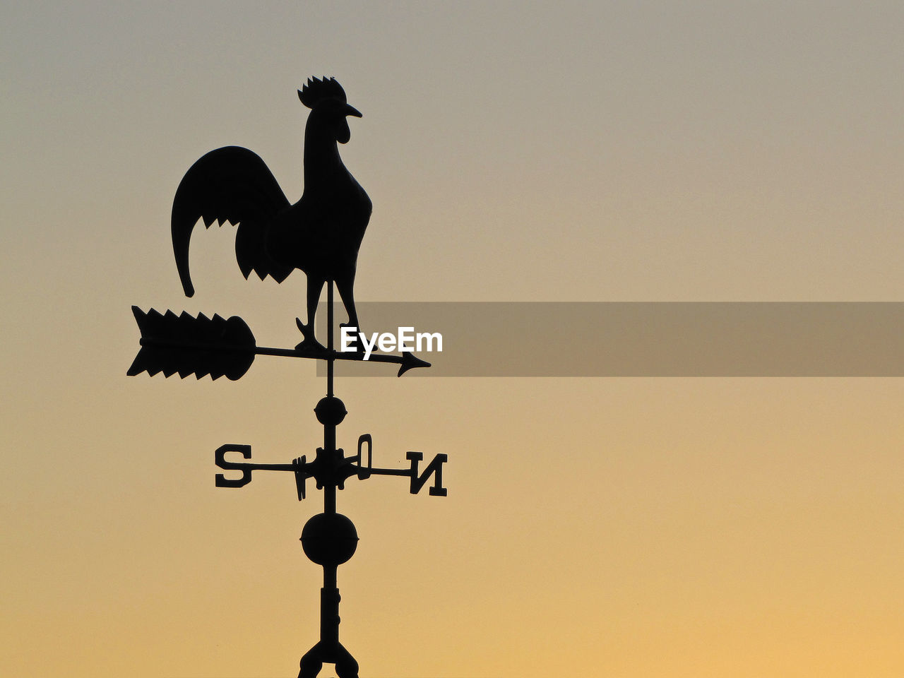 LOW ANGLE VIEW OF SILHOUETTE WEATHER VANE