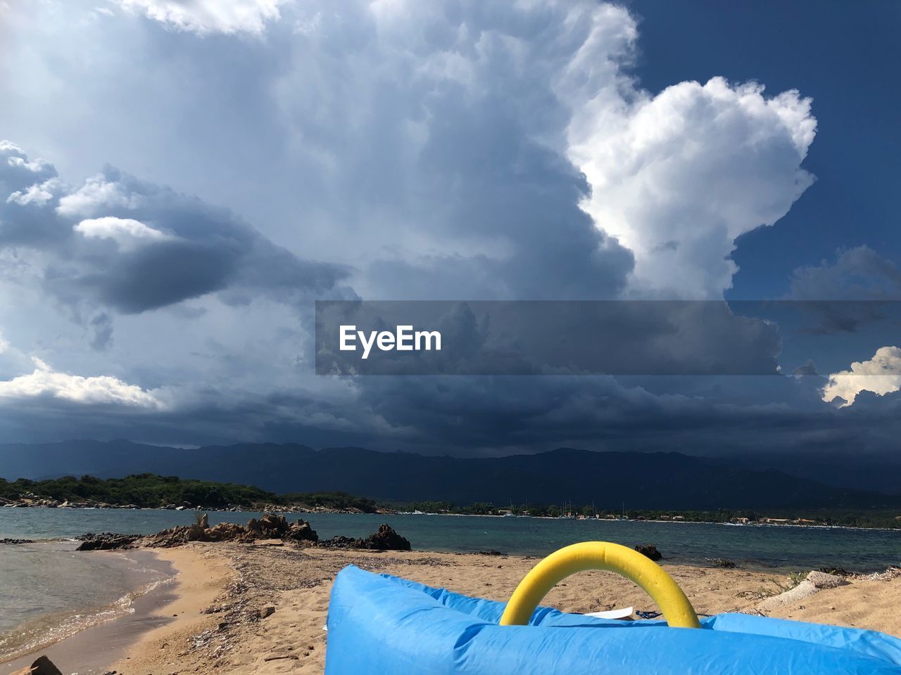 PANORAMIC VIEW OF BEACH AGAINST SKY