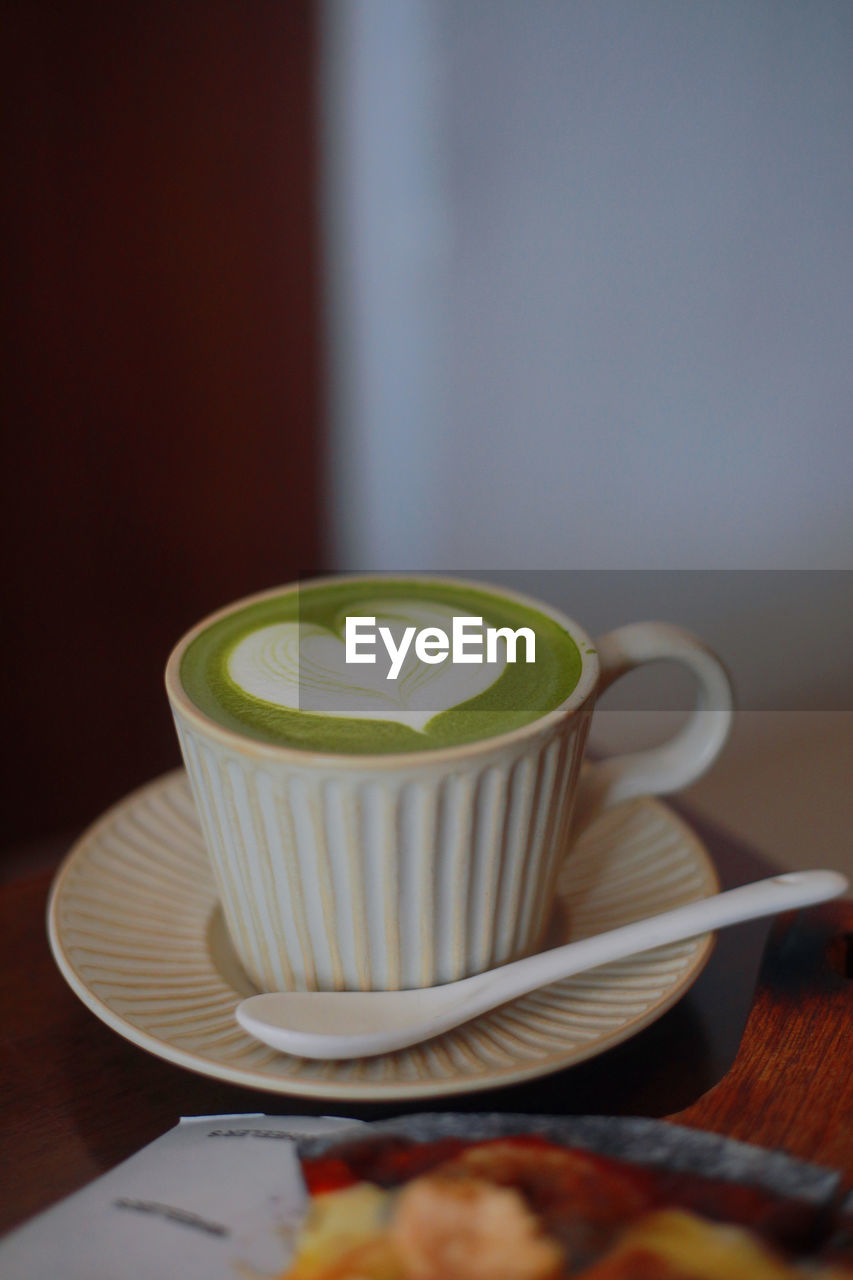 Close-up of matcha latte on table