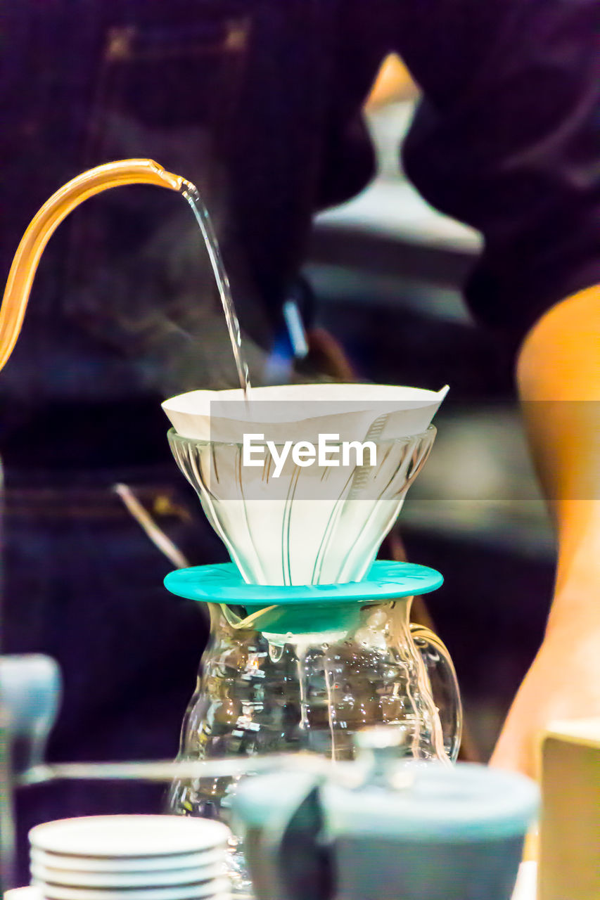 CLOSE-UP OF COFFEE IN GLASS