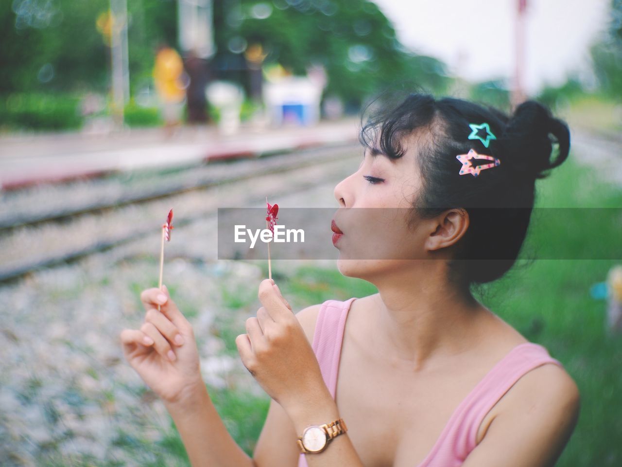 Close-up of woman playing with pinwheel toy