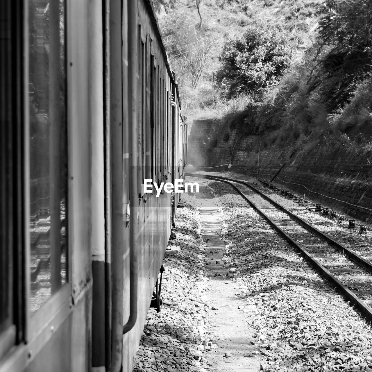 Kalka shimla toy train moving on mountain slope, beautiful view, one side mountain, one side valley