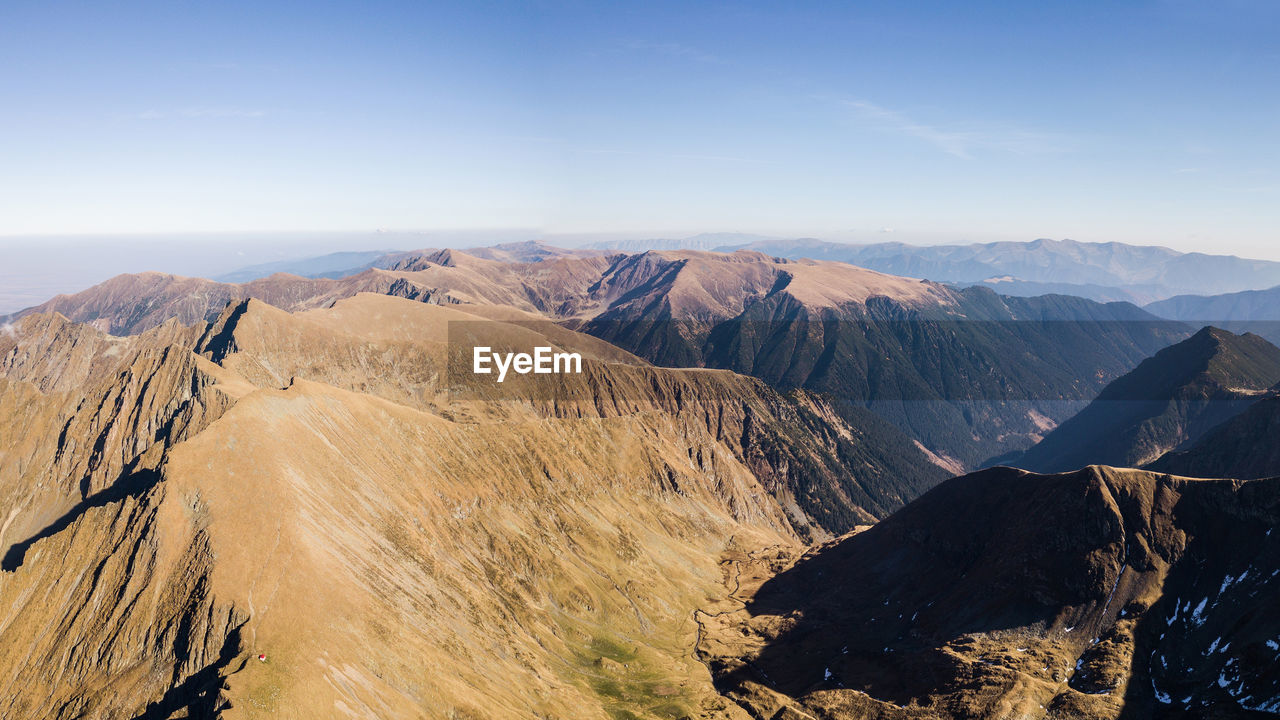 Aerial view of mountains against sky