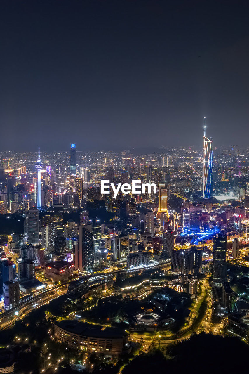 high angle view of illuminated cityscape at night