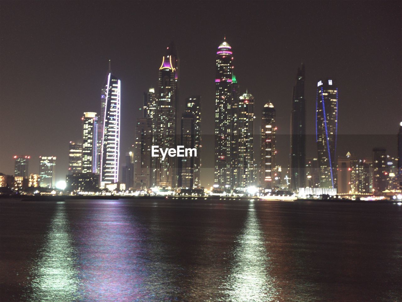 ILLUMINATED CITYSCAPE AT NIGHT