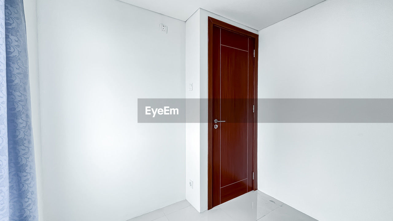 door, entrance, home interior, room, indoors, architecture, building, white, domestic room, wardrobe, no people, arcade, home, furniture, open, corridor, wall - building feature, house, interior design, wall, built structure, copy space, cupboard, luxury, lifestyles