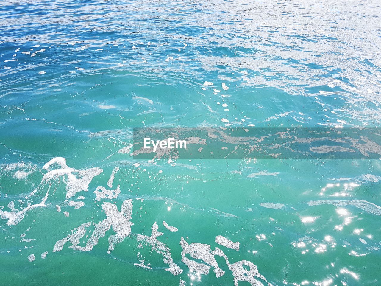 HIGH ANGLE VIEW OF SWIMMING POOL AT SEA