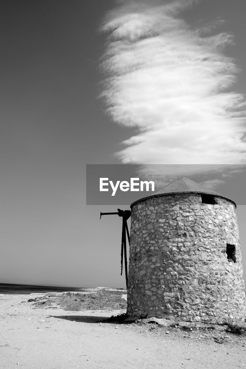 Traditional windmill against sky