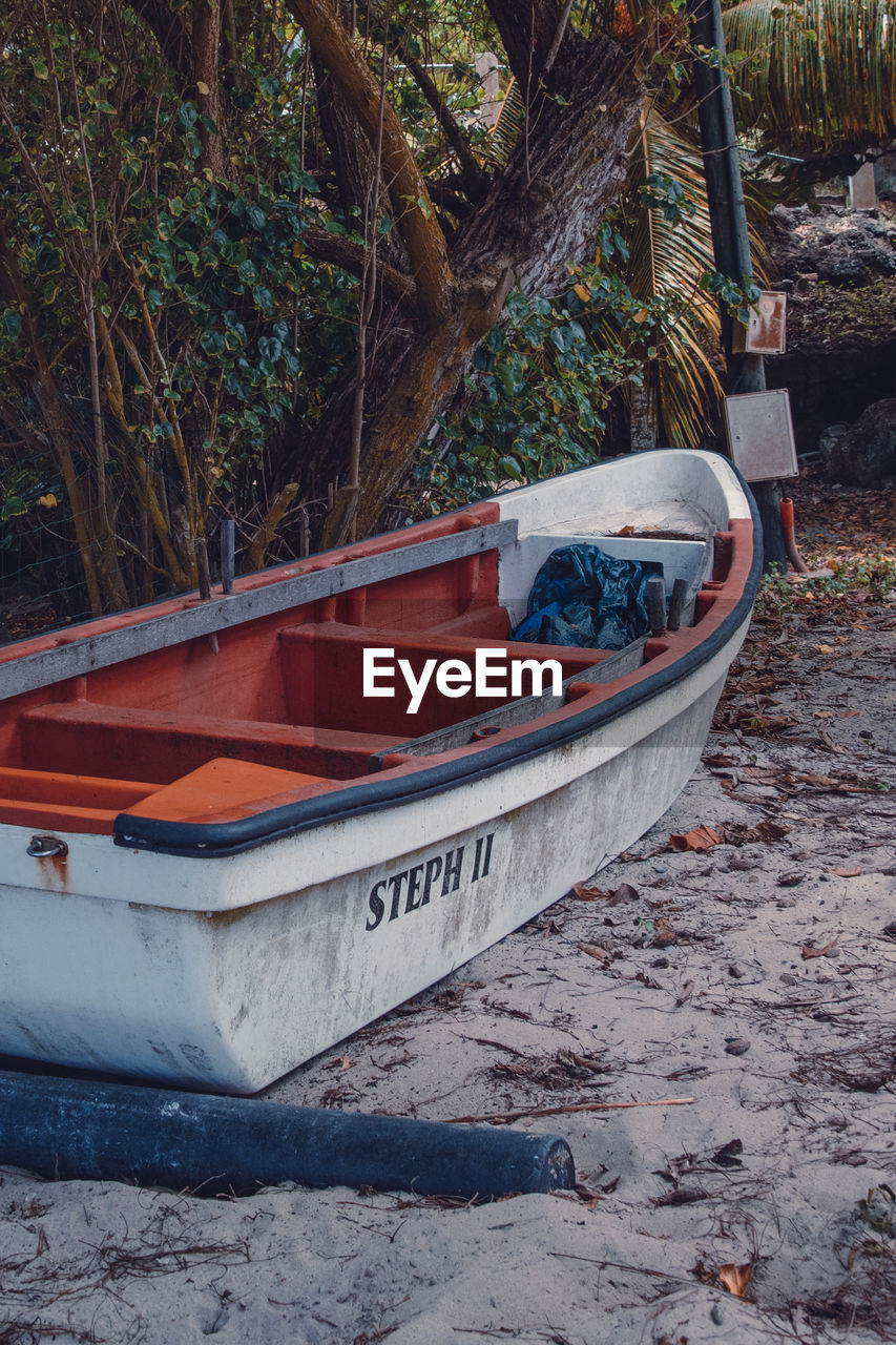 BOATS MOORED ON BEACH