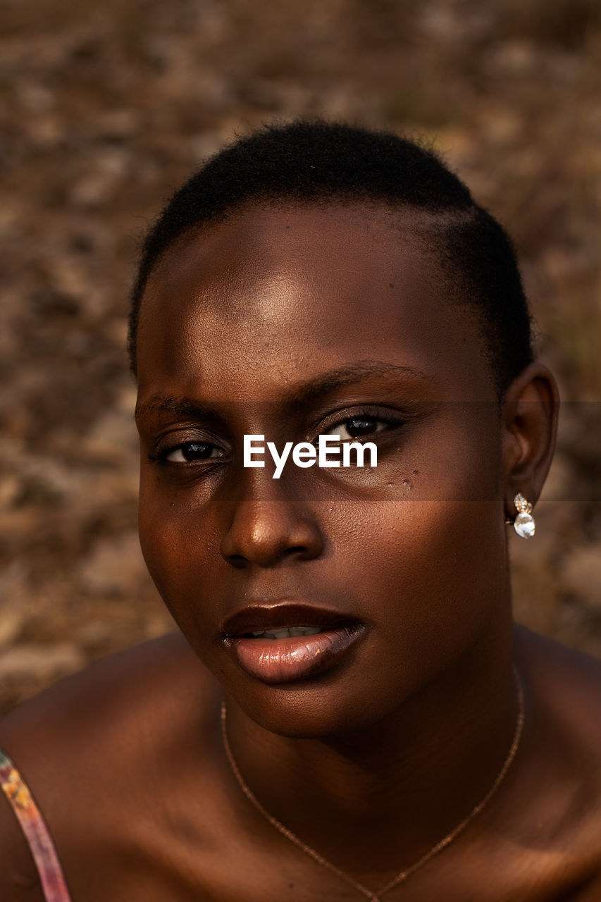 CLOSE-UP PORTRAIT OF YOUNG WOMAN WITH EYES CLOSED