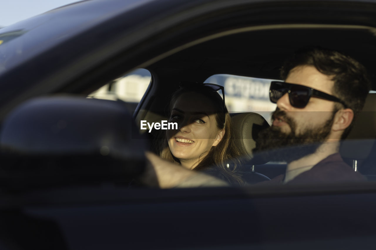 Couple sitting in car