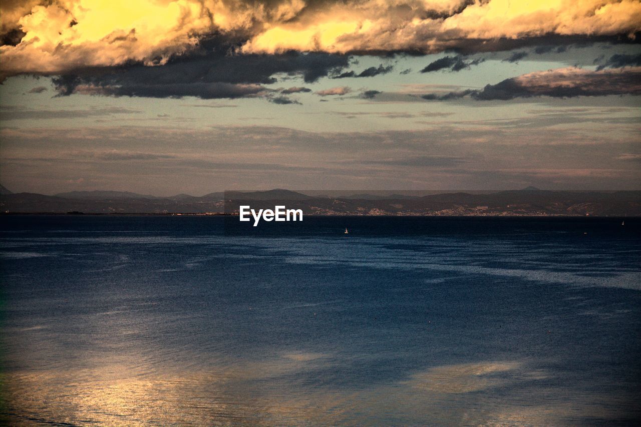 SCENIC VIEW OF SEA AND MOUNTAINS
