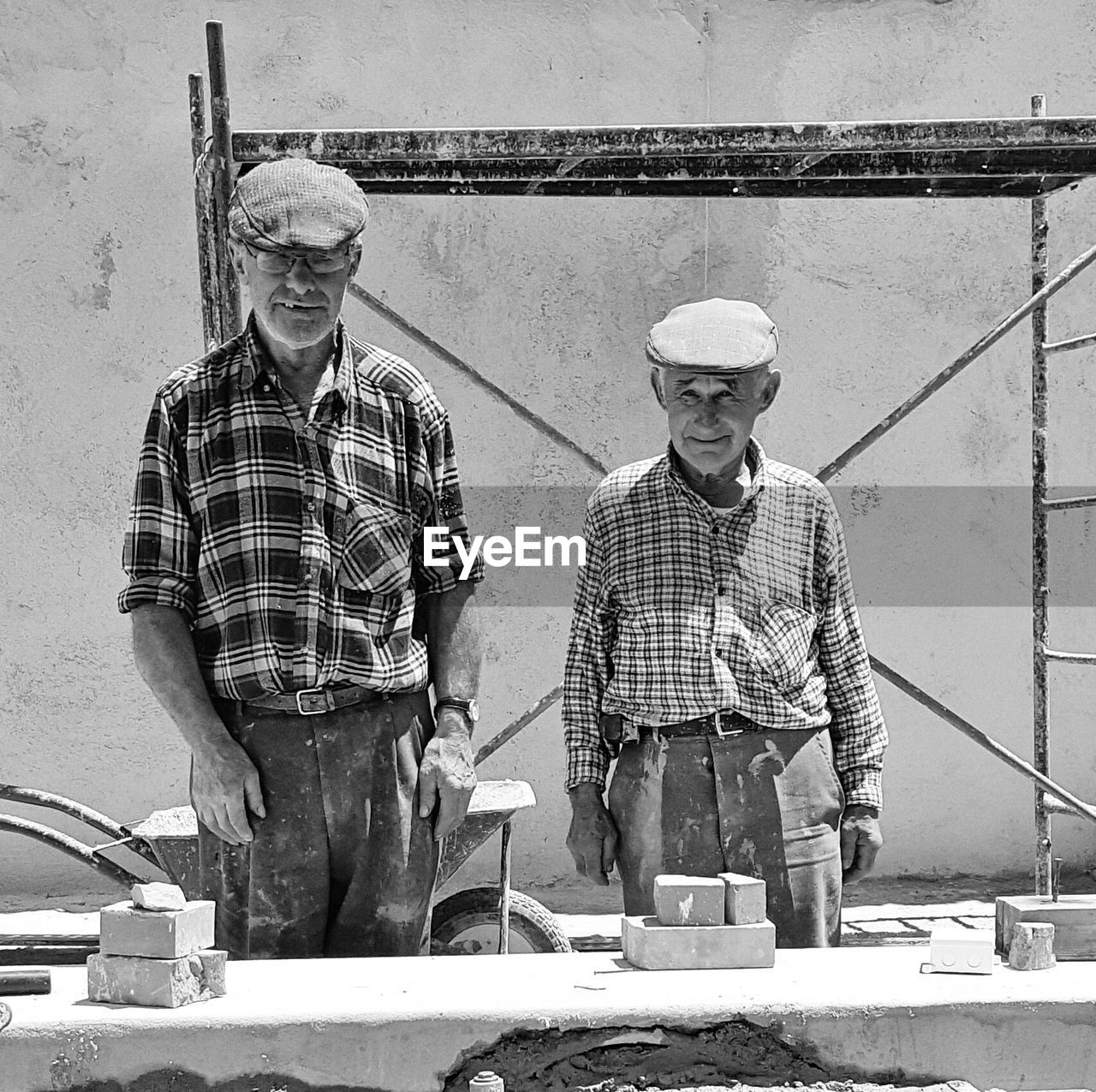 MEN WORKING IN SHOPPING CART