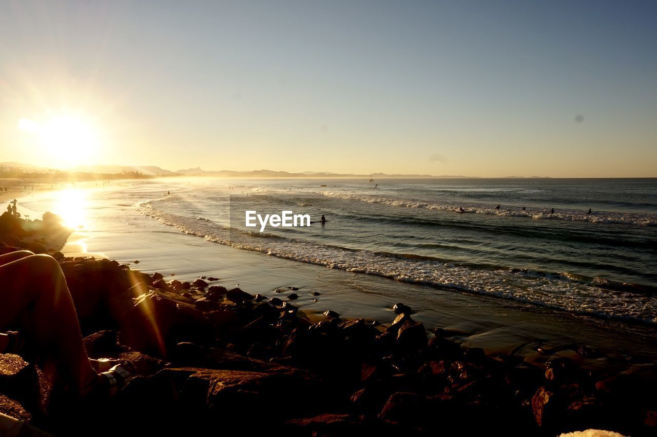 SCENIC VIEW OF BEACH DURING SUNSET