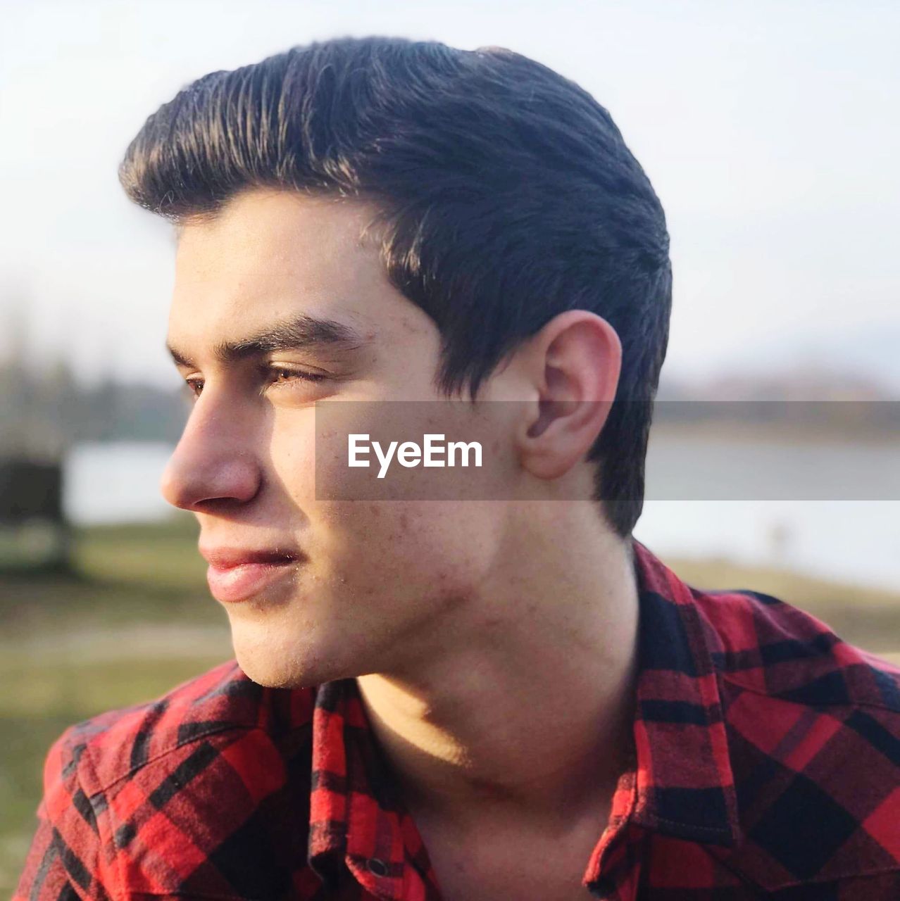 Close-up of young man looking away