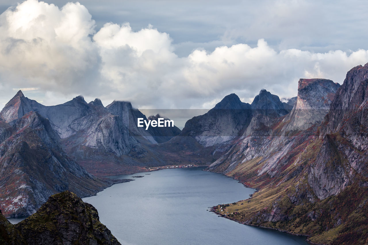 Scenic view of lake amidst mountains against sky