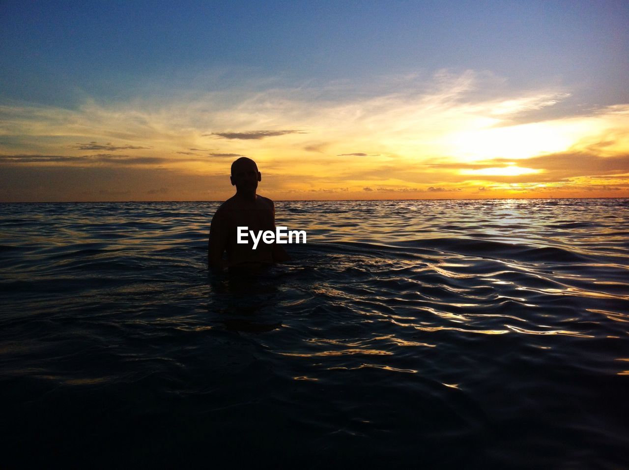 SILHOUETTE BOY ON BEACH AGAINST SKY DURING SUNSET