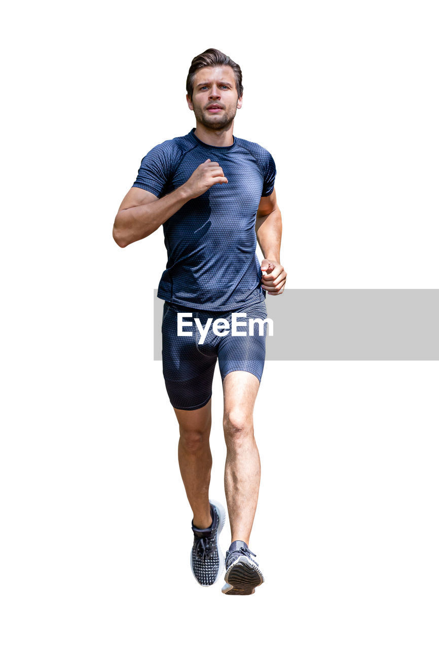 FULL LENGTH PORTRAIT OF MAN AGAINST WHITE BACKGROUND