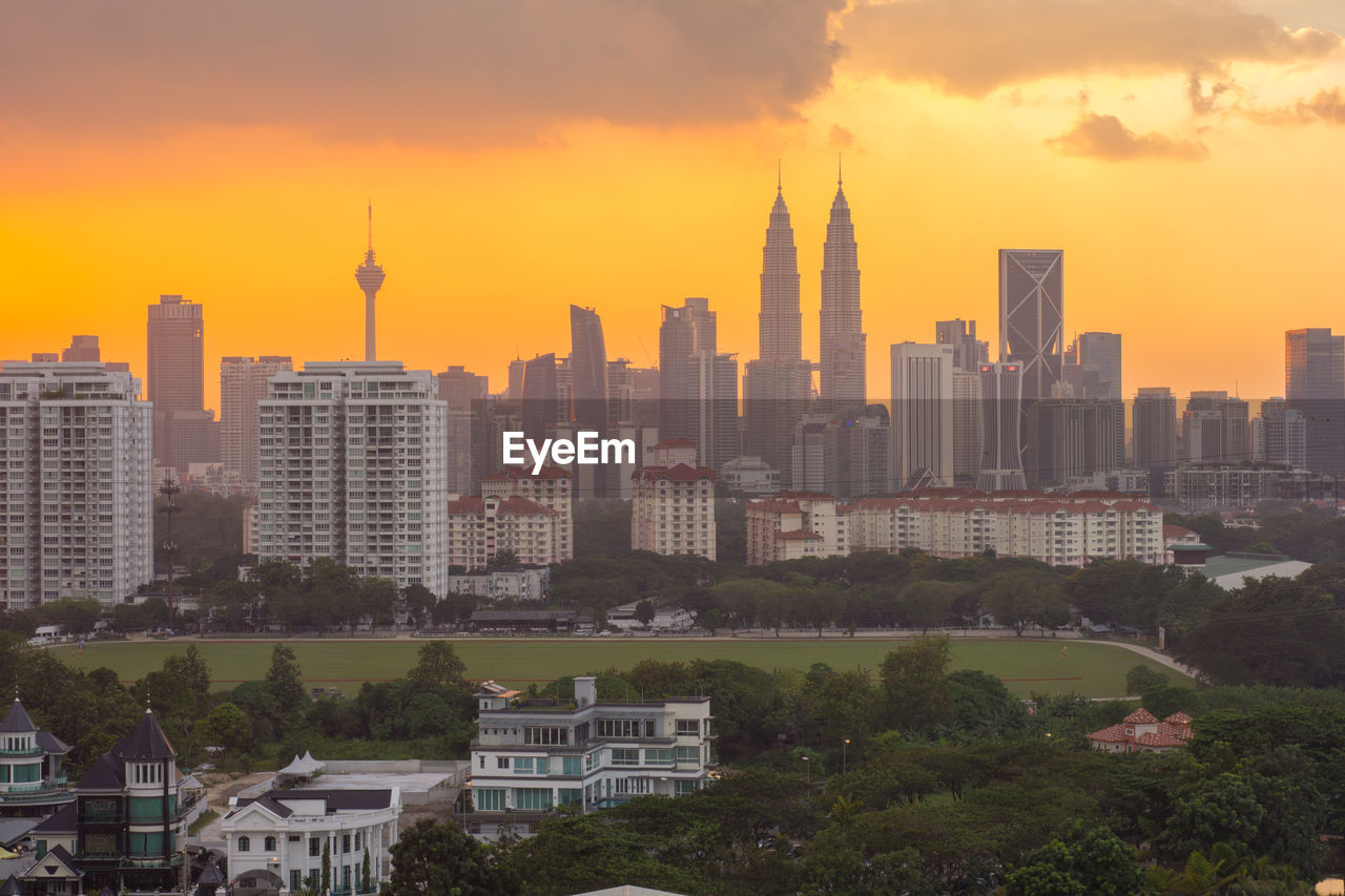 View of cityscape against sky during sunset