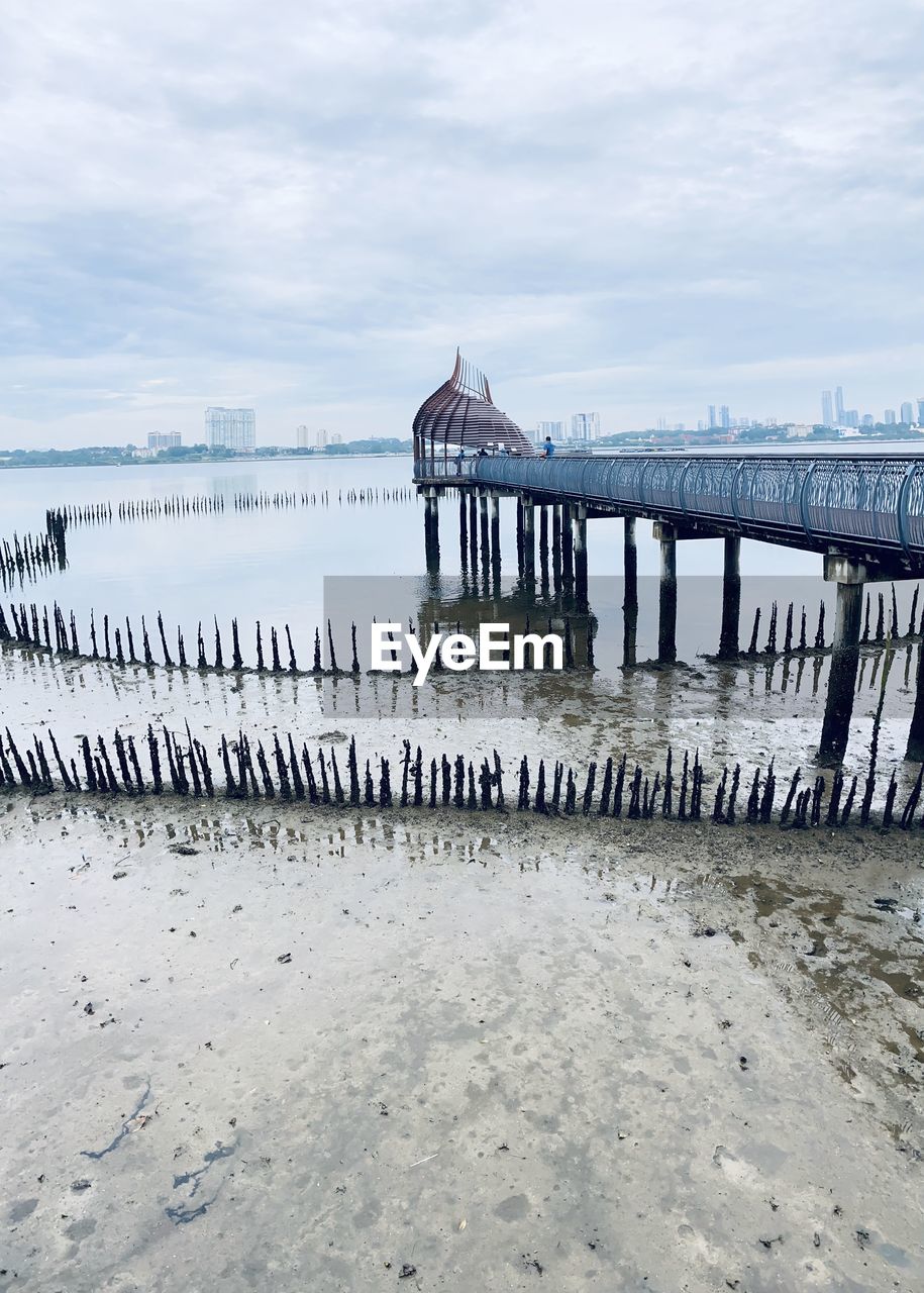 Pier over sea against sky