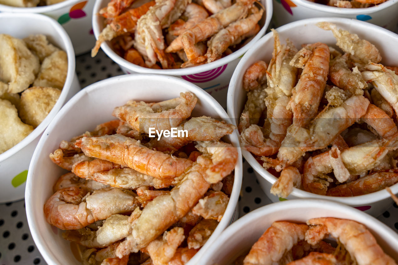 HIGH ANGLE VIEW OF SEAFOOD IN CONTAINER ON TABLE