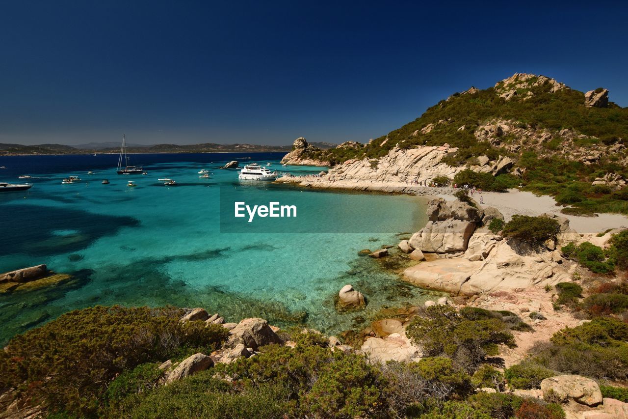 Scenic view of sea against clear blue sky