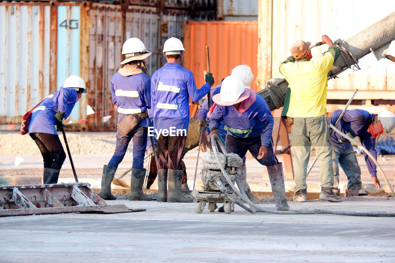 PEOPLE WORKING ON CONSTRUCTION SITE