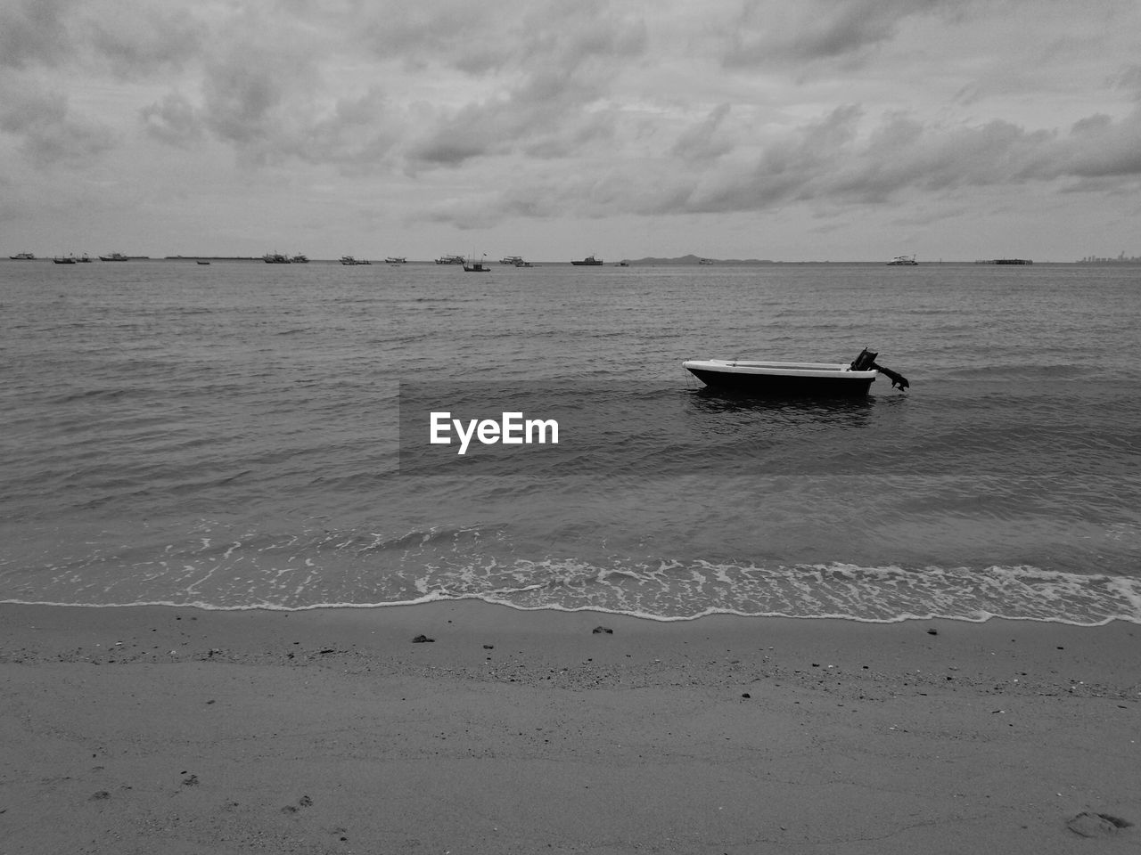 BOAT ON SEA AGAINST SKY
