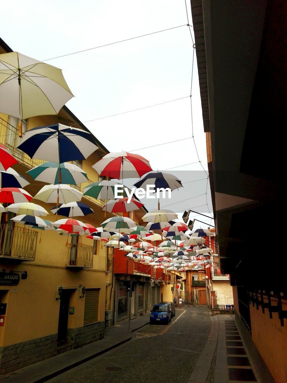 MULTI COLORED UMBRELLAS IN CITY