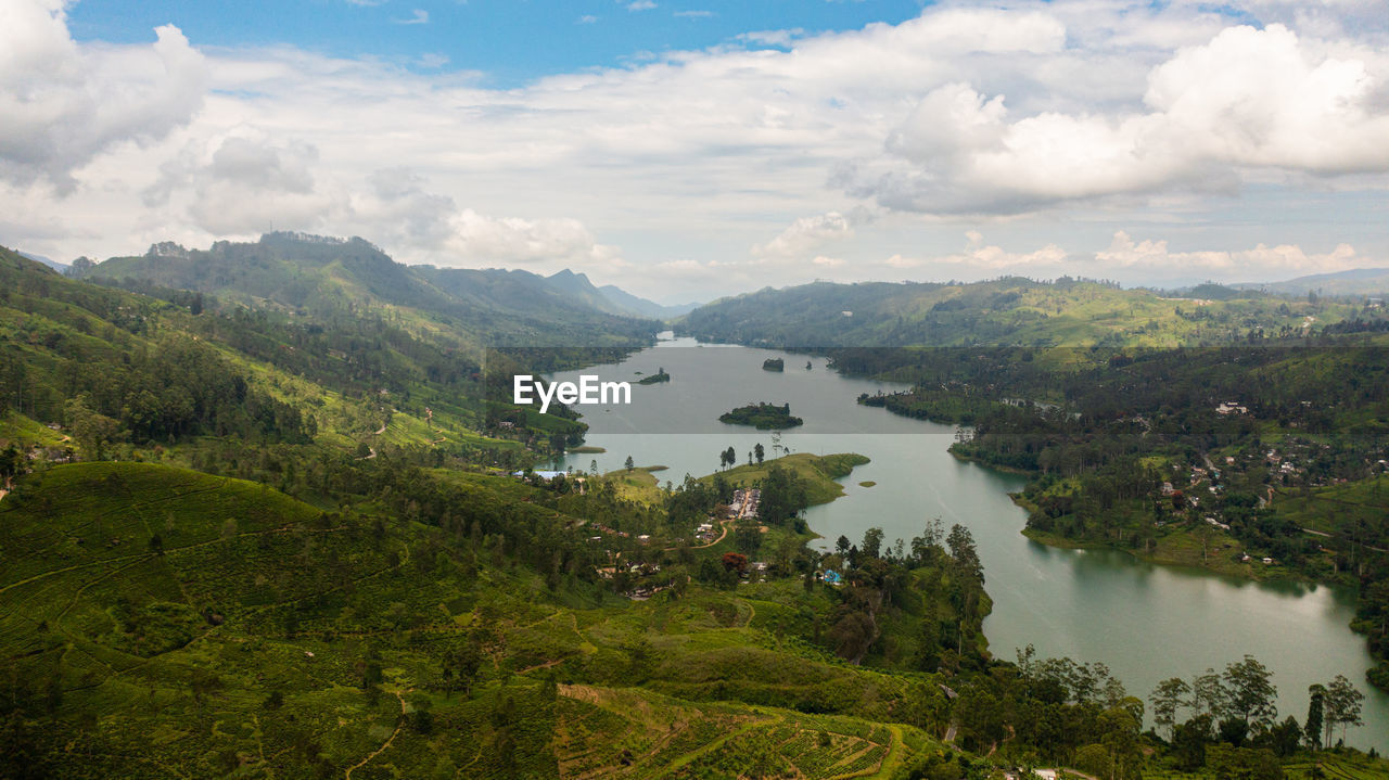 Aerial drone of hills with tea plantations around the lake in the mountains. maskeliya