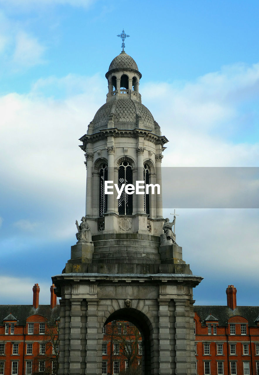 Low angle view of the campanile of trinity college dublin against sky