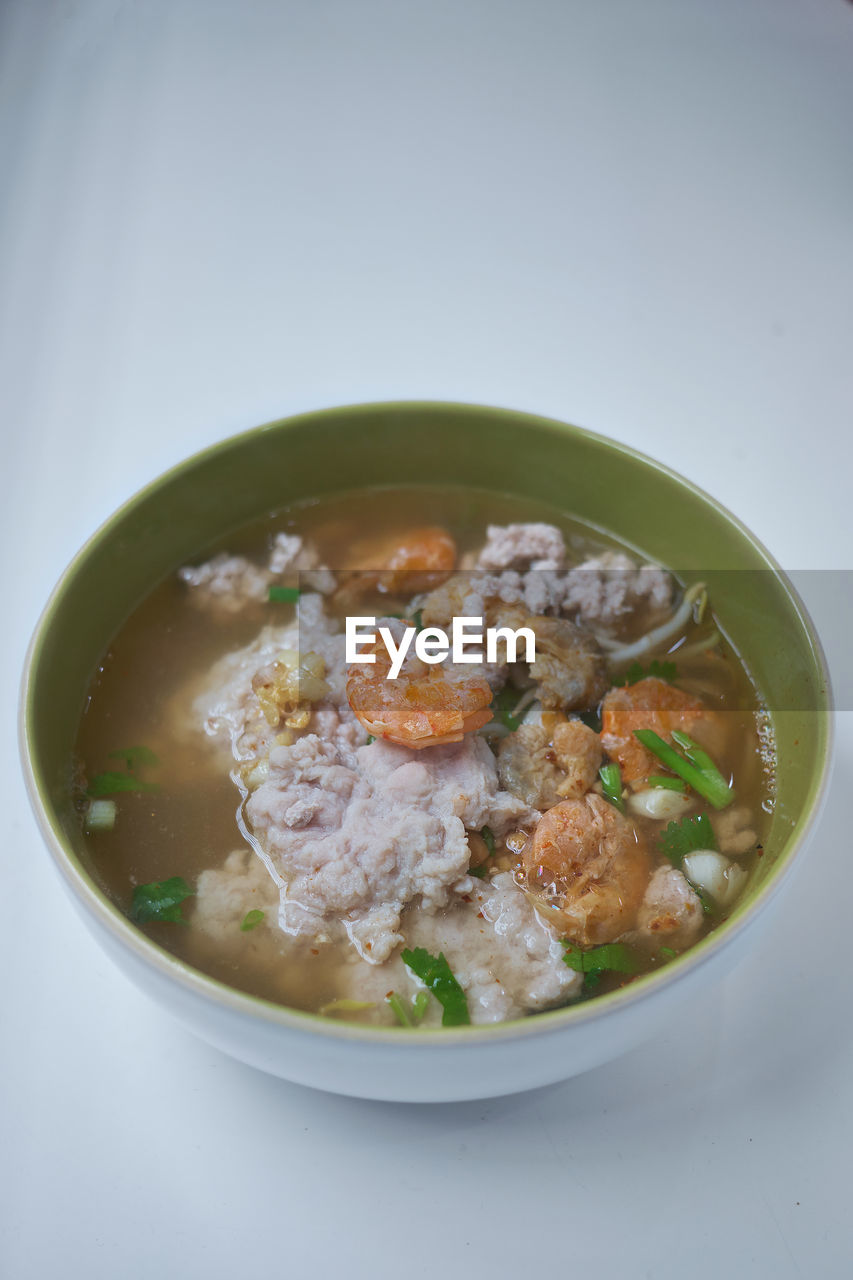 CLOSE-UP OF SOUP IN BOWL ON TABLE