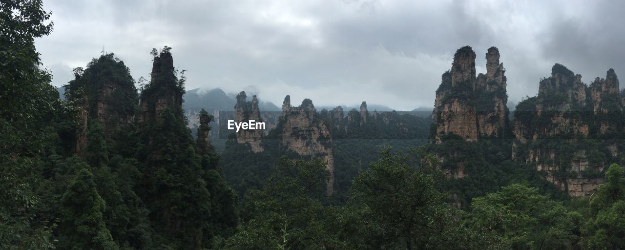 Scenic view of landscape against cloudy sky