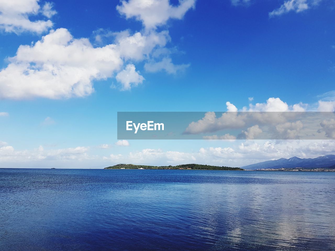 Scenic view of sea against blue sky