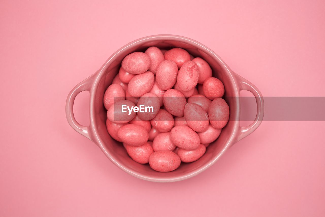 Directly above shot of easter eggs candies in bowl