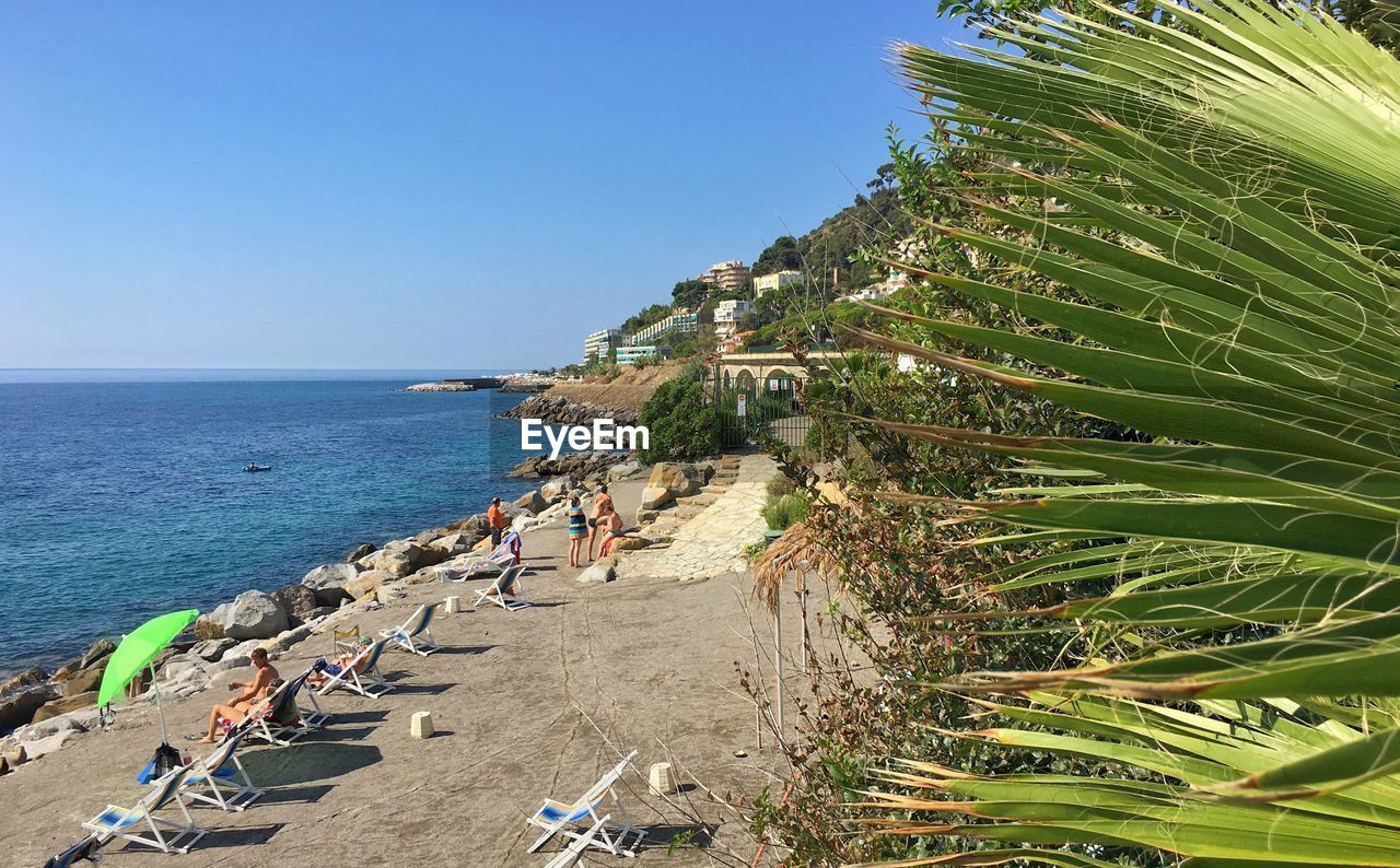 Scenic view of beach against blue sky